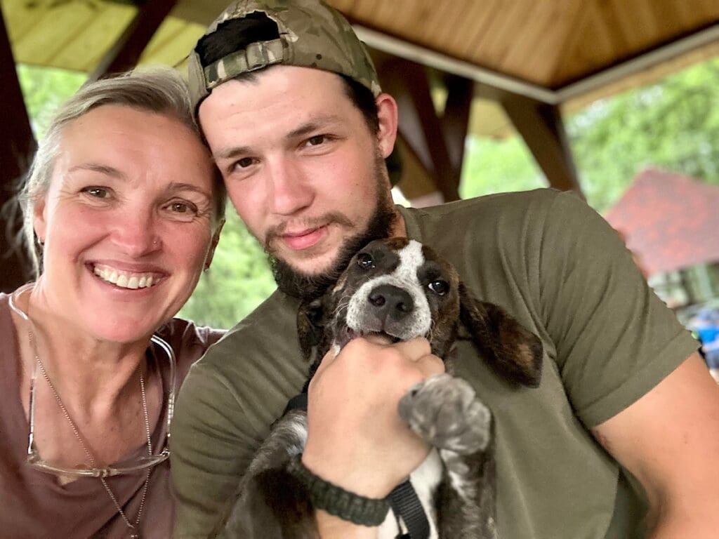 mark and lara - OPT a woman a man and a puppy
