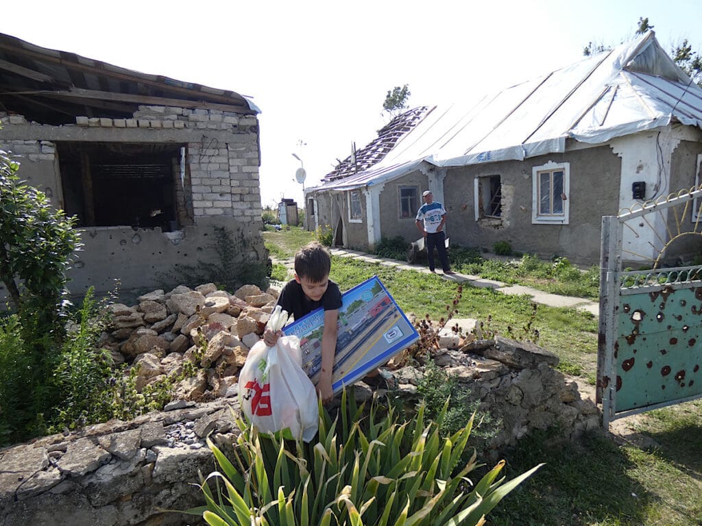 IMG_5702 - OPT boy receives gift in bombed house