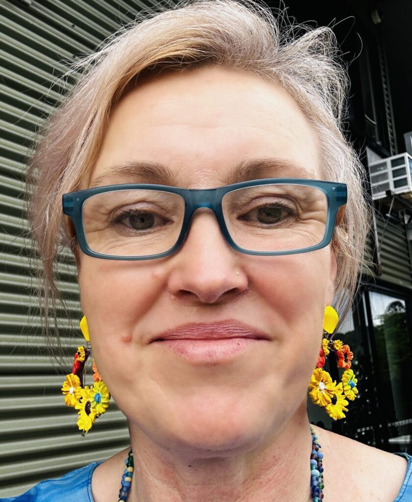savingPNG_2 - OPT Author wearing vinok themed hoop earrings