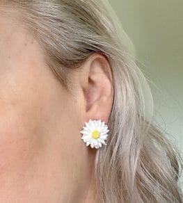 Stud earrings in the form of flowers white flower
