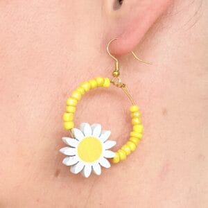 Handmade earrings with big daisies and yellow beads