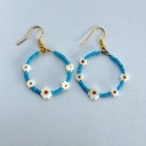 Handmade hoop earrings with small daisies