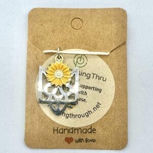 pendant in the form of the Ukrainian national emblem with a sunflower