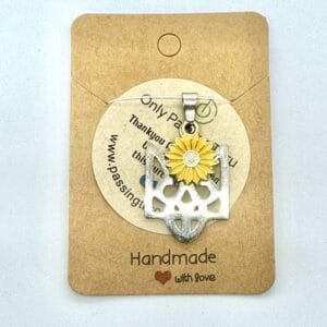 pendant in the form of the Ukrainian national emblem with a sunflower