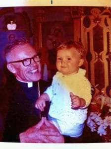 a man smiling at a baby