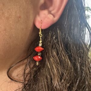 lady modelling red sandalwood earrings