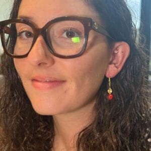 lady modelling earrings with Red Sandalwood beads