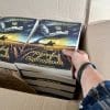 Under black banners box ukrainian a hand reaching into a box of books under black banners