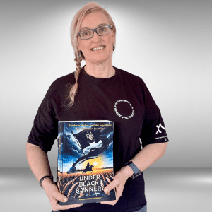 a woman holding a copy of under black banners