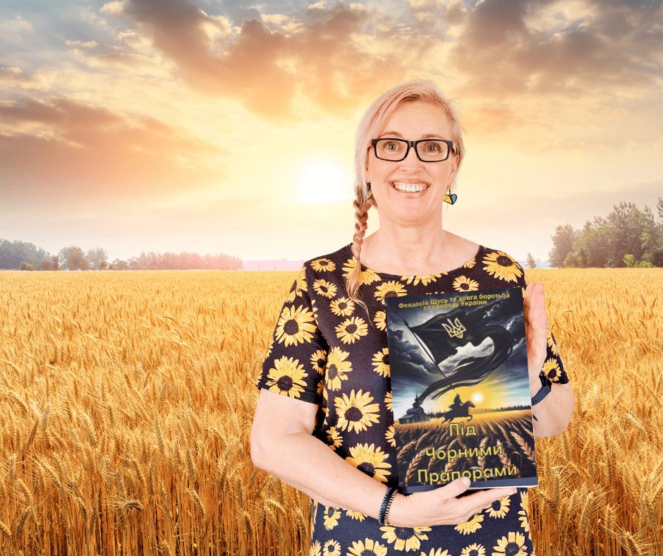 lara book ukr field a woman in a wheat field holding a copy of under black banners book