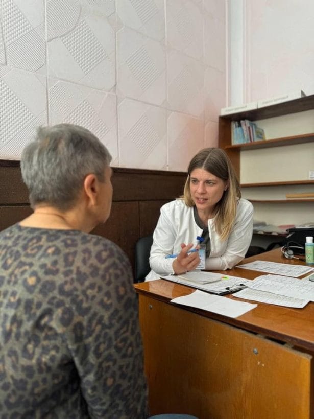 mobile clinic - OPT - OPT a doctor talks to an old lady