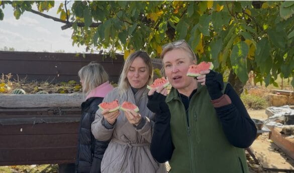 img_7447 two women eating watermelon